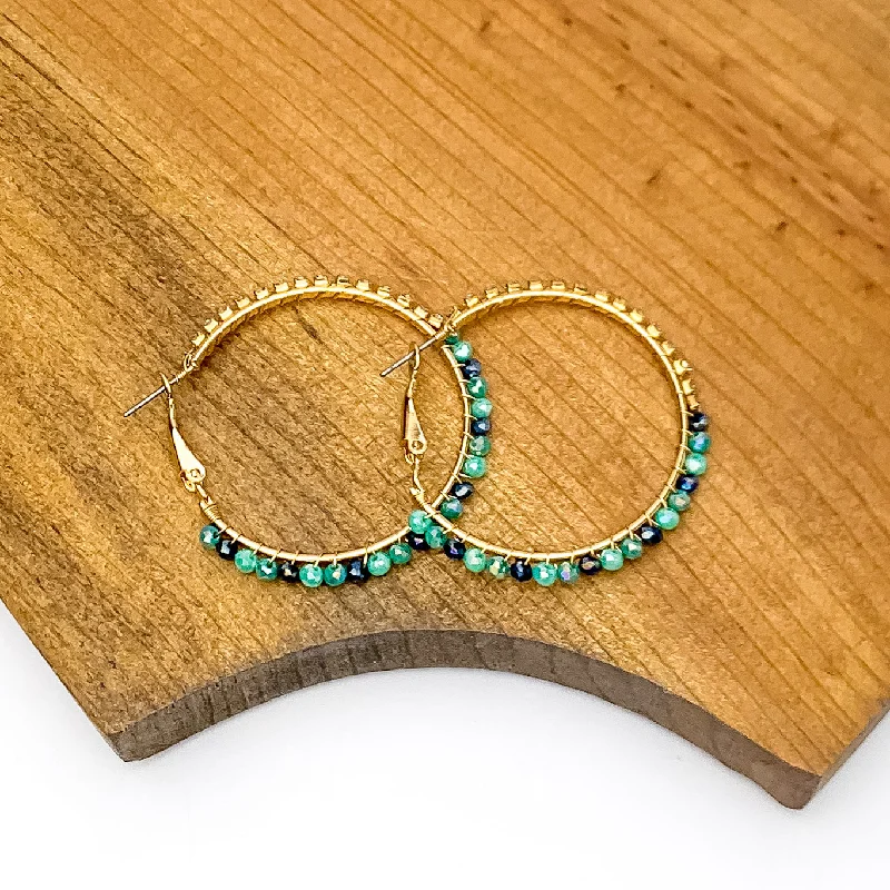 Women’s statement earrings-Gold Tone Hoop Earrings Wrapped in Clear and Blue Crystals