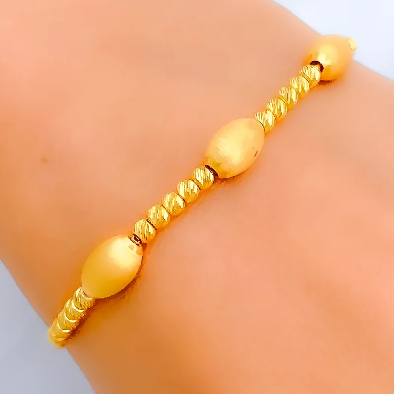 Women’s tennis bracelets-Women’s tennis bracelets-Elevated Oval Bead 21k Gold Bolo Bracelet